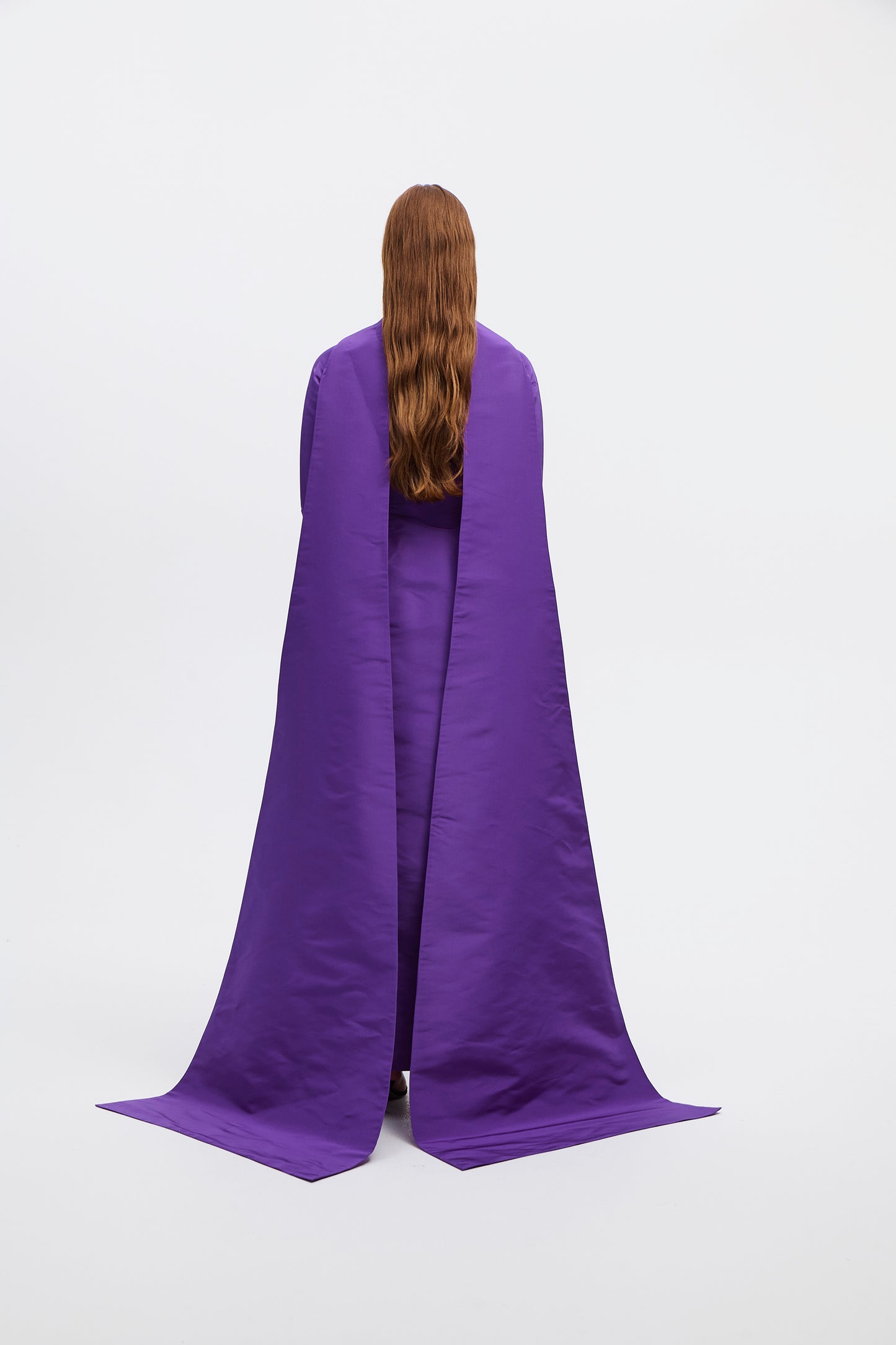 Draped back cape full sleeves gown in silk faille