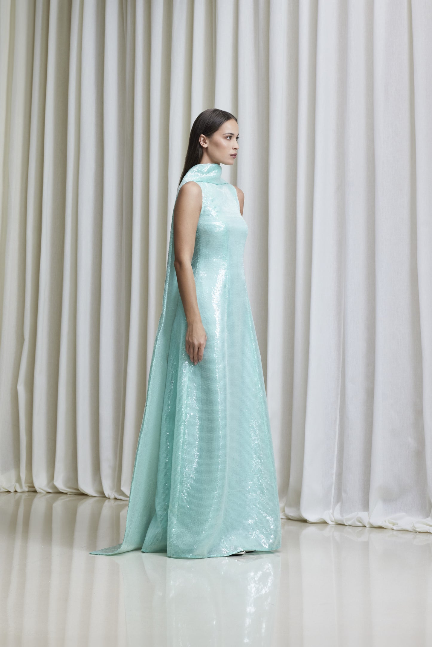 Draped back cape mint green sequined gown in silk organza