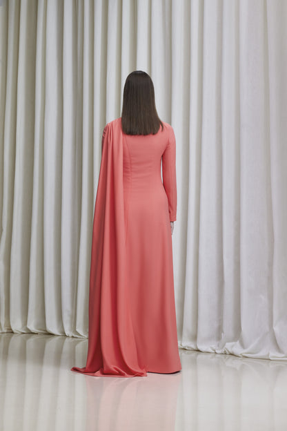 Long sleeve asymmetric back cape gown in crepe.