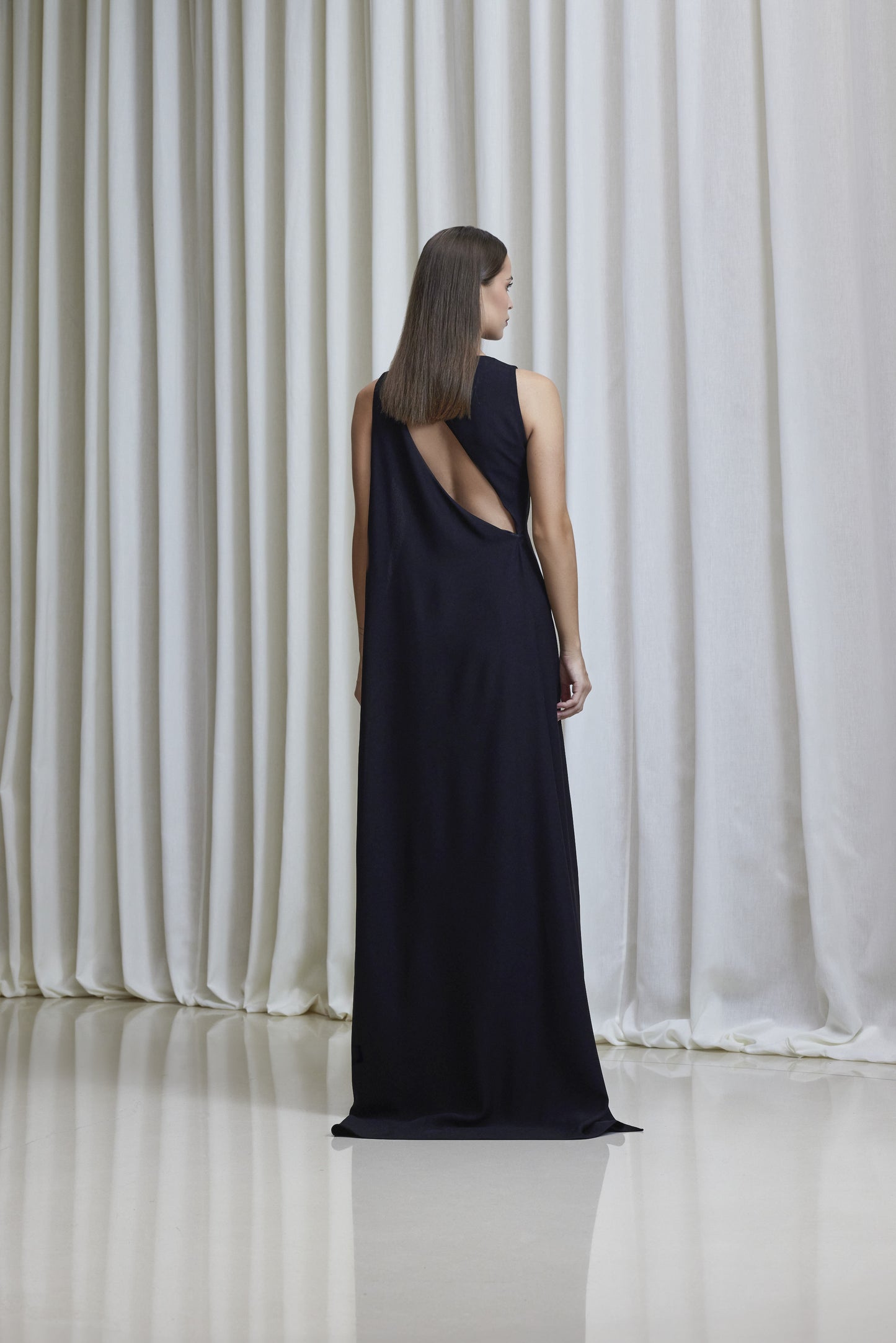 Boat neckline, asymmetric open back cape gown in crepe