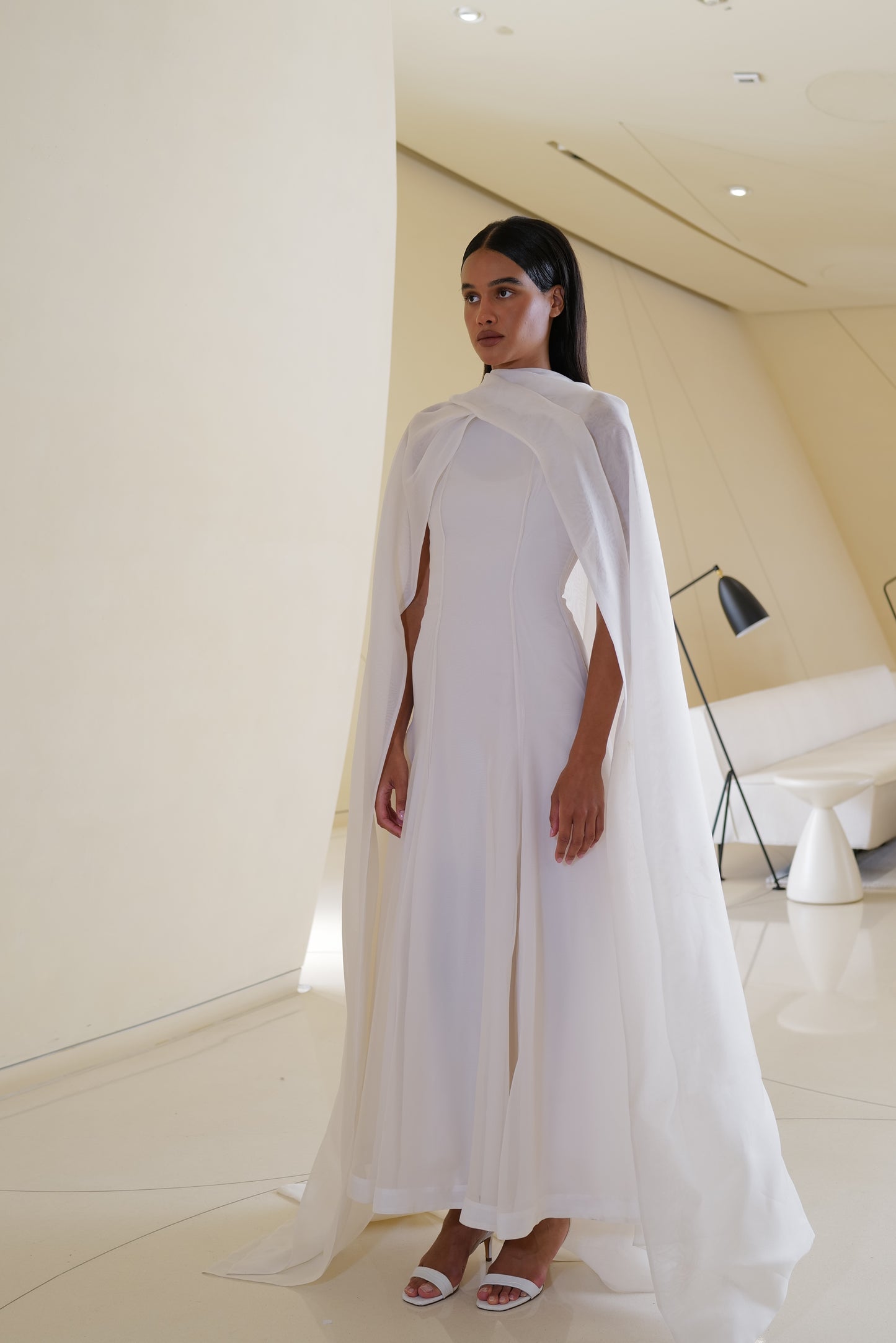 Voluminous gown with  wrap cape in silk organza