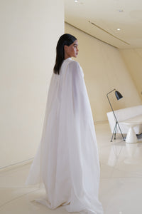 Voluminous gown with  wrap cape in silk organza